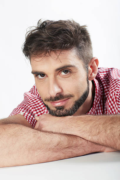 istock Handsome man portrait sitting hand on chin 175514502