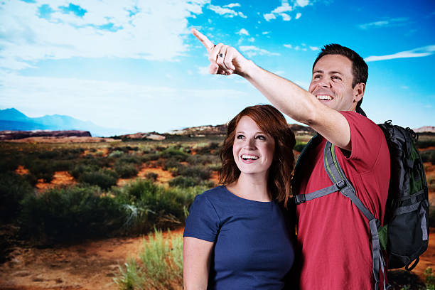 istock Happy couple looking away in an arid area 175514866