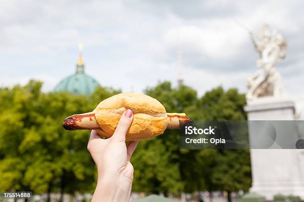 Female Hand Holding A Sausage With Roll Stock Photo - Download Image Now - Baked, Berlin, Berlin Cathedral
