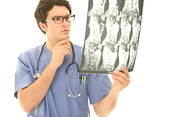 istock Medical doctor examing MRI scan 175515441