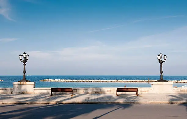 "Bari, promenade with bench and lamppost. Apulia - ItalyThe seafront of Bari with its benches and typical street lamps - Puglia, Italy"