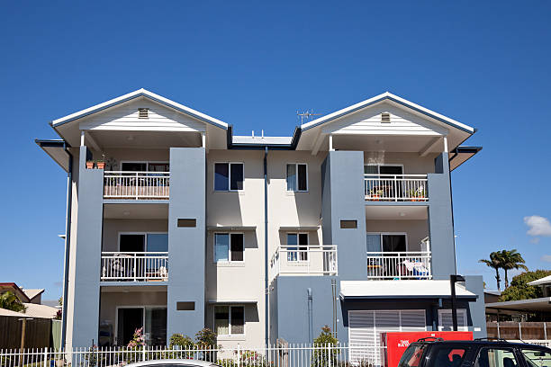 City Apartment Building with blue sky "City residential apartment building in Mackay, Queensland, Australia with blue sky aa typical rental urban housing. Click to see more..." mackay stock pictures, royalty-free photos & images