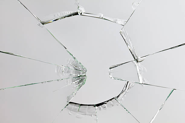 壊れたガラス - bullet hole glass cracked hole ストックフォトと画像