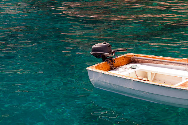 Small boat in the ocean stock photo