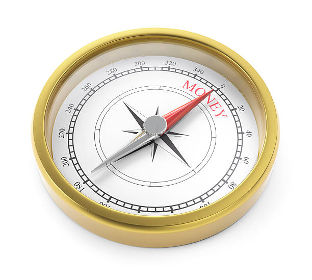 istock gold compass pointing to money 175516760