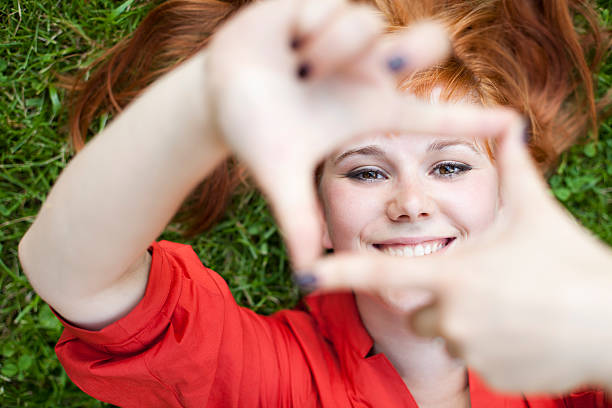 istock Happy Young Woman Frames Face With Fingers 175517105