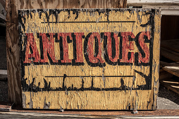 istock corroded antiques sign yellow with red and black lettering 175517593