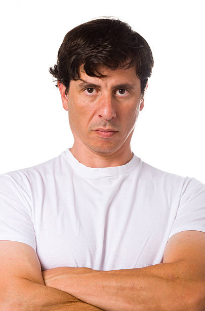 Man with White T-Shirt and Folded Arms stock photo