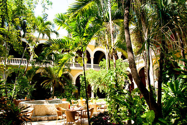 colonial architecture: lush courtyard with tables and fountain