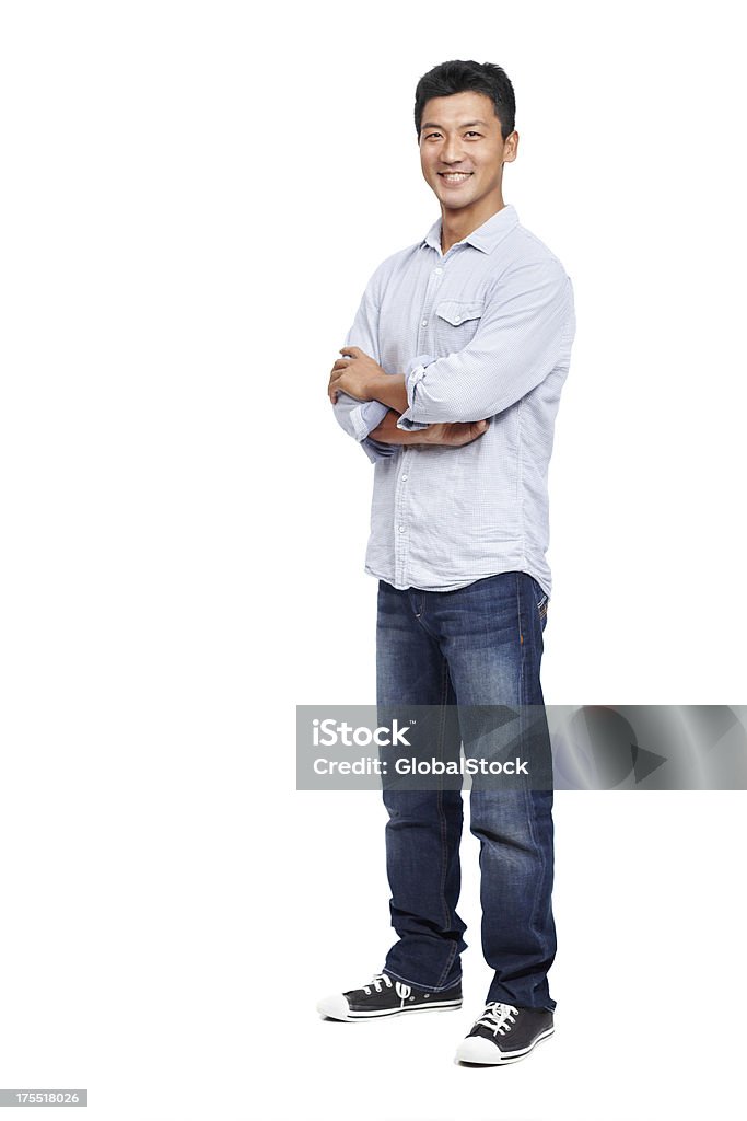 Approaching life with a great attitude is key Happy young Asian man standing with his arms folded and smiling while isolated on white - copy space Men Stock Photo