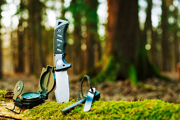 basic survival tools "basic survival tools essential for the outdoors: knife, compass and lighterCHECK OTHER SIMILAR IMAGES IN MY PORTFOLIO...." penknife stock pictures, royalty-free photos & images