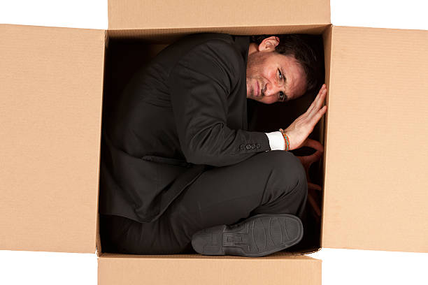istock Businessman in a cardboard box 175518560