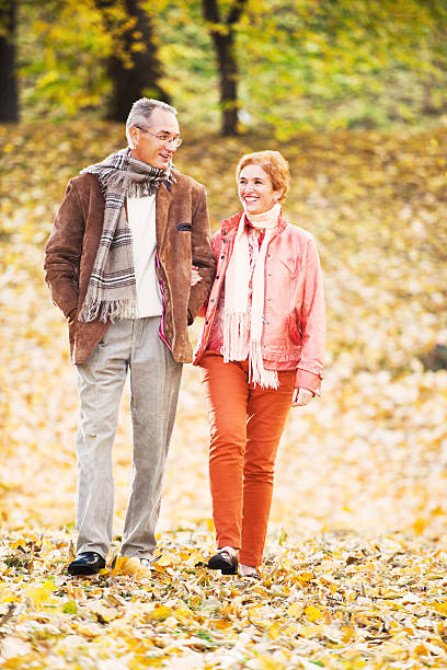 istock Beautiful mature couple walking in park. 175519077