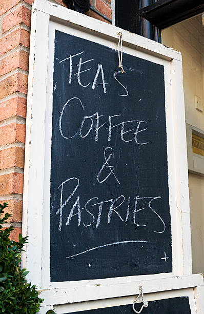 istock Tea, coffee and pastries sign on a blackboard. 175519213