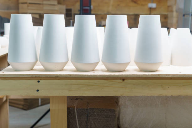 istock Finished plaster products: vases, figurines, bowls. Making and casting decorative dishes and vases from plaster for home decoration in the workshop. successful micro-enterprise in the crafts and home decor industry. 1755192502
