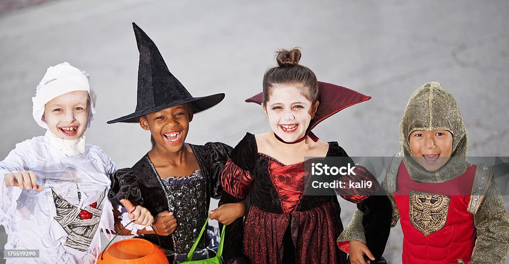 Children in halloween costumes Multi-ethnic children wearing Halloween costumes. Halloween Stock Photo