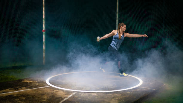 istock Female track and field athlete throwing discus 1755196957