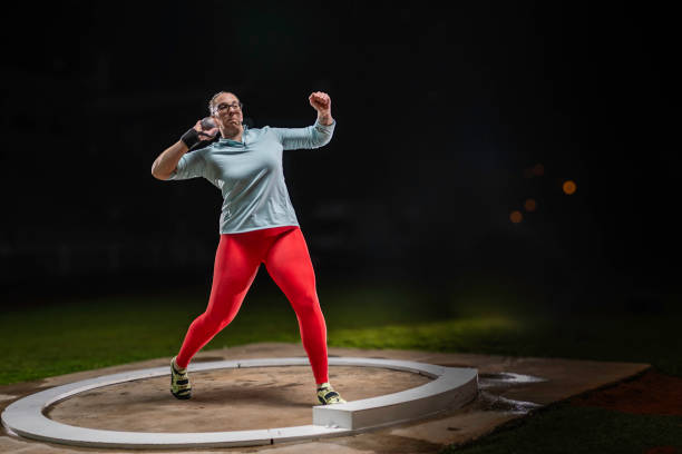 istock Female athlete throwing shot put 1755196963