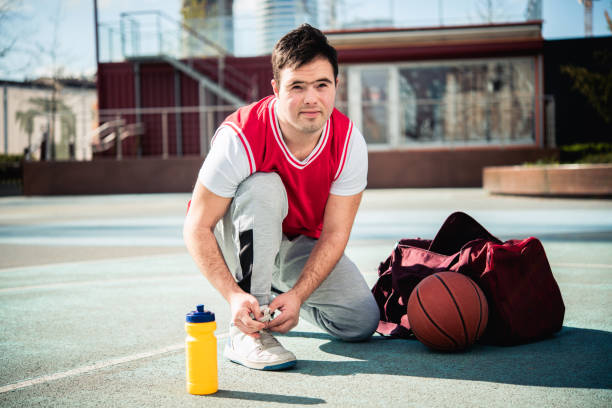 istock Man with Down syndrome plays sports 1755197522