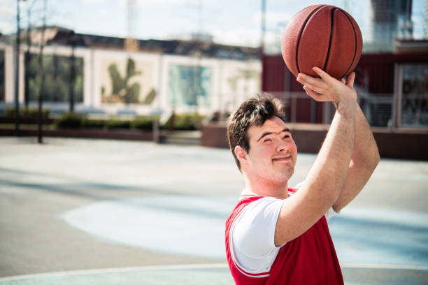 istock Man with Down syndrome plays sports 1755197524