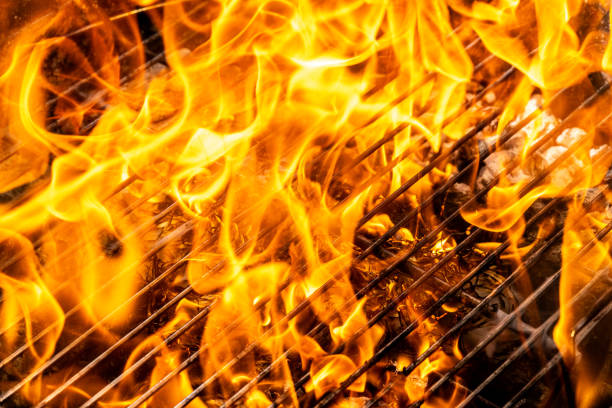 istock Charcoal barbecue grill in flames 1755200436