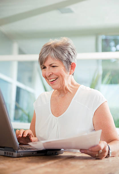 Senior woman on her laptop stock photo