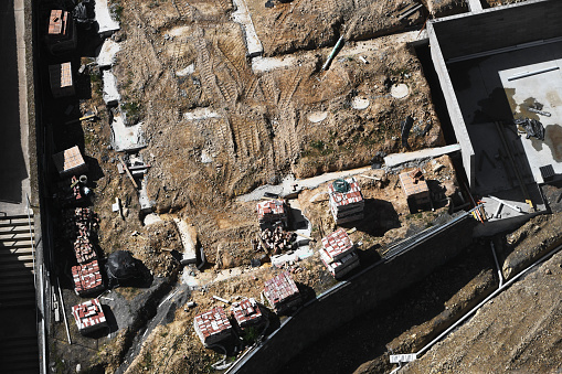 Aerial perspective of an under-construction shed site, highlighting preparations for future use.