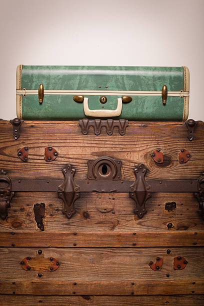 istock Retro Green Suitcase Sitting on Wood Trunk 175520855