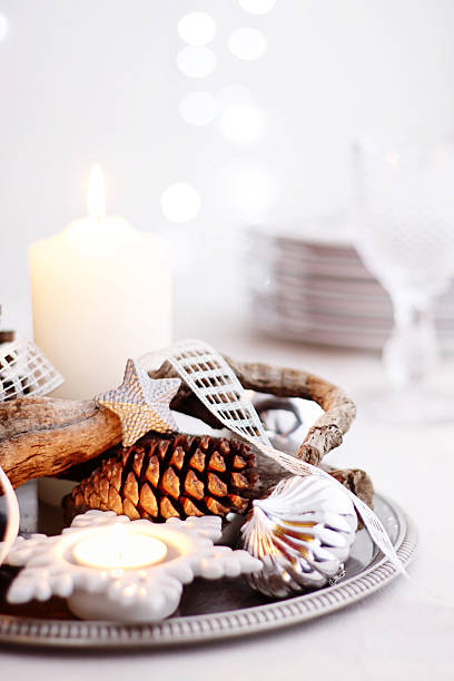 istock Christmas centerpiece with candles, pine cones, branch and silver decor 175521601