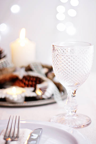 istock Table setting with glass of wine and Christmas centrepiece 175521620