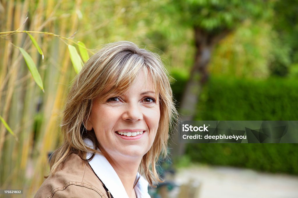 Happy mature woman outdoor portrait Women Stock Photo