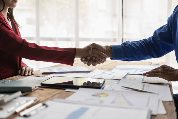 istock Businessmen join hands for teamwork in business mergers and acquisitions, successful negotiations, with partners celebrating partnership. Close-up pictures 1755220379
