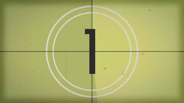 10 seconds vintage film countdown on faded yellow background