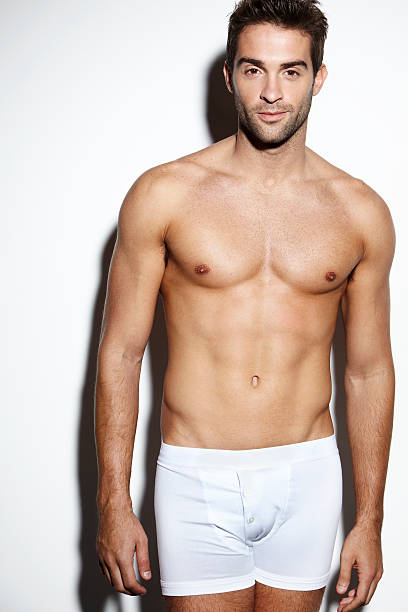 Attractive bare-chested male in underwear Attractive bare-chested male in underwear man muscular chest stock pictures, royalty-free photos & images