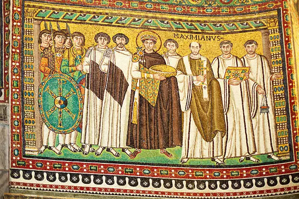 "Court of Emperor Justinian with (right) archbishop Maximian and (left) court officials and Praetorian Guards.The Basilica (Church) of San Vitale in Ravenna, is one of the most important examples of early Christian Byzantine art and architecture in western Europe. The Basilica combines Roman elements (the dome, shape of doorways, and stepped towers) with Byzantine elements (polygonal apse, capitals, and narrow bricks).  The church is most famous for its wealth of Byzantine mosaics, the largest and best preserved outside of Constantinople.   Ravenna was the capital city of the Western Roman Empire from 402 until its collapse in 476, Then it served as the capital of the Kingdom of the Ostrogoths until it was conquered in 554. Afterwards, the city formed the centre of the Byzantine Exarchate of Ravenna until the invasion of the Franks in 751, which appointed it as the seat of the Kingdom of the Lombards. It is one of eight Ravenna structures included by UNESCO in its World Heritage List."