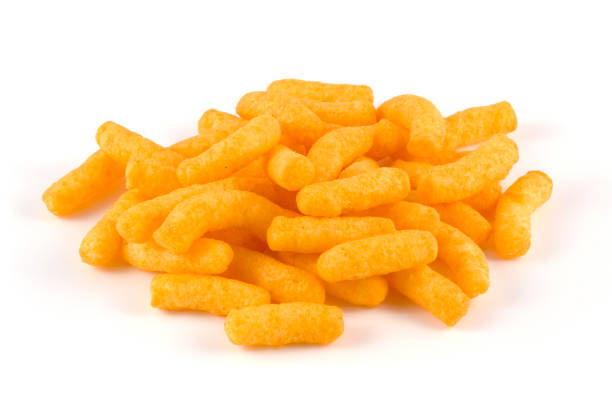 A heap of cheese puffs on a white background.