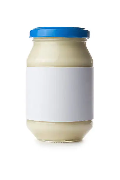 Mayonnaise jar with a blank label isolated on a white background. Ideal for imposing your own artwork onto.
