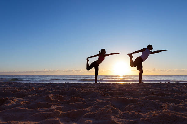 istock Woman and man doing yoga 175523947