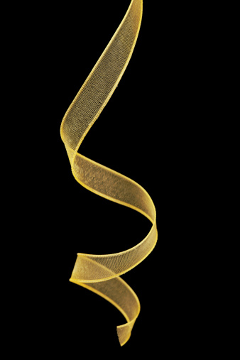 Gold ribbon design element isolated on black