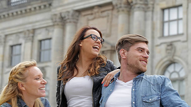 istock three friends laughing out loud 175524840