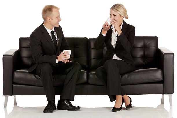 istock Business couple sitting on couch and having coffee 175525154