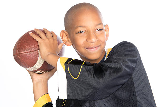 Young boy throwing a football