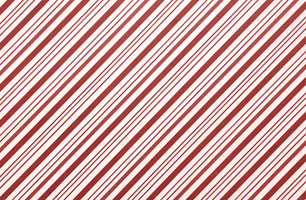 レッドキャンディケインストライプのクリスマスの包装紙の背景 - wrapping paper striped paper christmas ストックフォトと画像