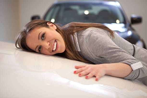 istock Woman embracing car. 175527146