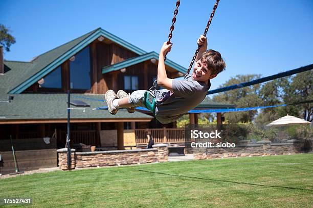 Swing In A Front Yard Stock Photo - Download Image Now - 10-11 Years, Architecture, Boys