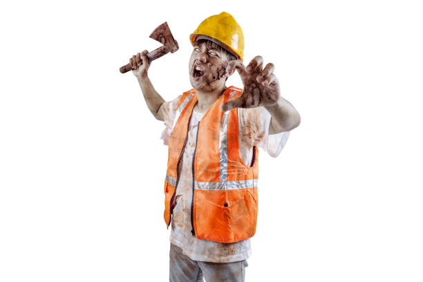 istock A scary construction worker zombie with blood and wounds on his body walking while carrying an axe 1755275791