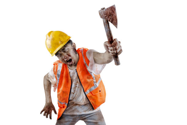 istock A scary construction worker zombie with blood and wounds on his body walking while carrying an axe 1755276316