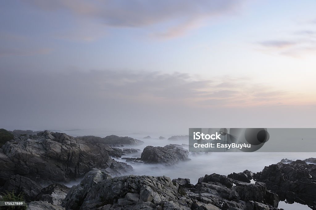 Rocky coastline Sunrise on rocky coastline of Maine (USA) with fog and blurred motion of the wave blended together. Best of Maine and New England in lightbox below... Coastline Stock Photo