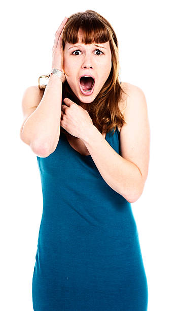 istock Shocked young redhead gasps in horrified surprise 175528106