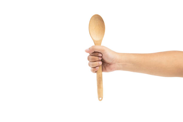 istock Human hand holding wooden spoon 1755283436
